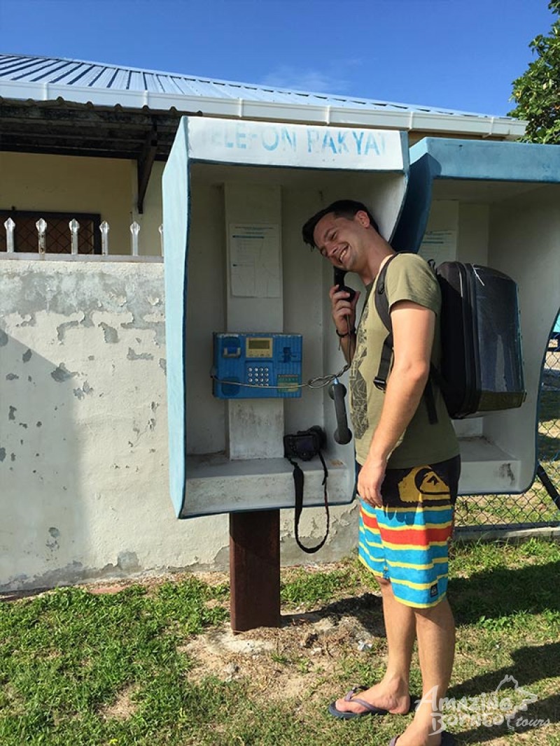 quaint blue telephone boxes at fisherman village, sabah